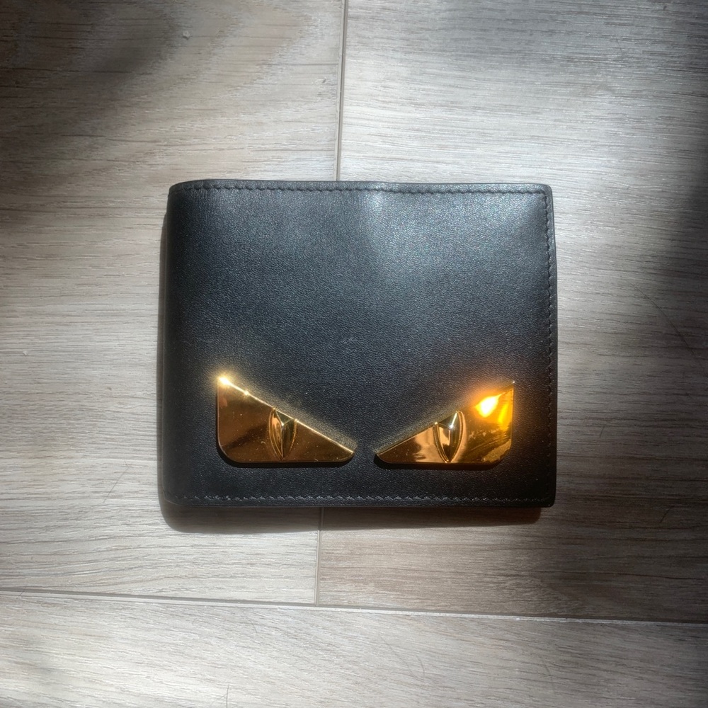 Black and gold fendi billfold